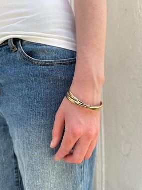 Brandy Melville interlaced gold coloured bangles